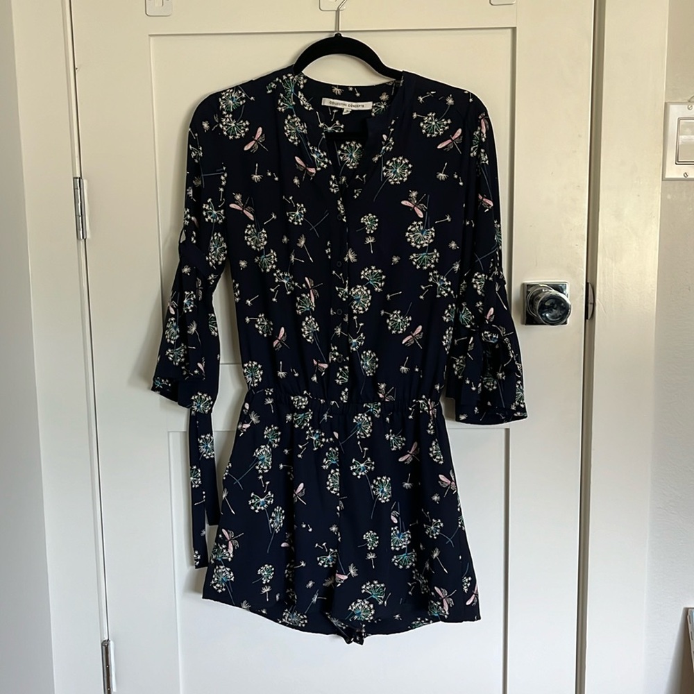 Small, navy romper with dragonfly and dandelion pattern by Collective Concept